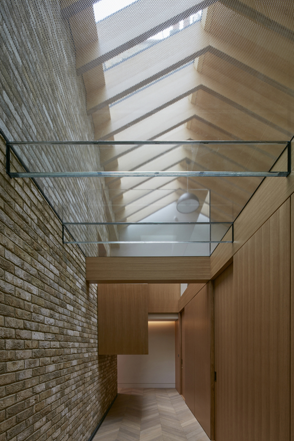 Hidden House Chelsea Knightsbridge LTS Architects - internal view, timber trusses, brickwork and new rooflight